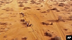 FILE - People arrive at a displacement camp near Dollow, Somalia, Sept. 21, 2022, amid a drought. The United Nations estimates that 1.4 million Somalis have been displaced by current droughts. Somalia's census team will count temporary nomadic settlements using satellite imagery.