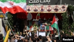 People in Tehran, Iran, gather for the funeral of members of the Islamic Revolutionary Guard Corps killed on April 1, 2024, in a suspected Israeli airstrike at the Iranian embassy in Damascus, Syria, April 5, 2024. (West Asia News Agency via Reuters)