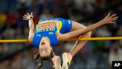 FILE - Yaroslava Mahuchikh of Ukraine makes an attempt in the women's high jump final at the the European Athletics Championships in Rome on June 9, 2024.