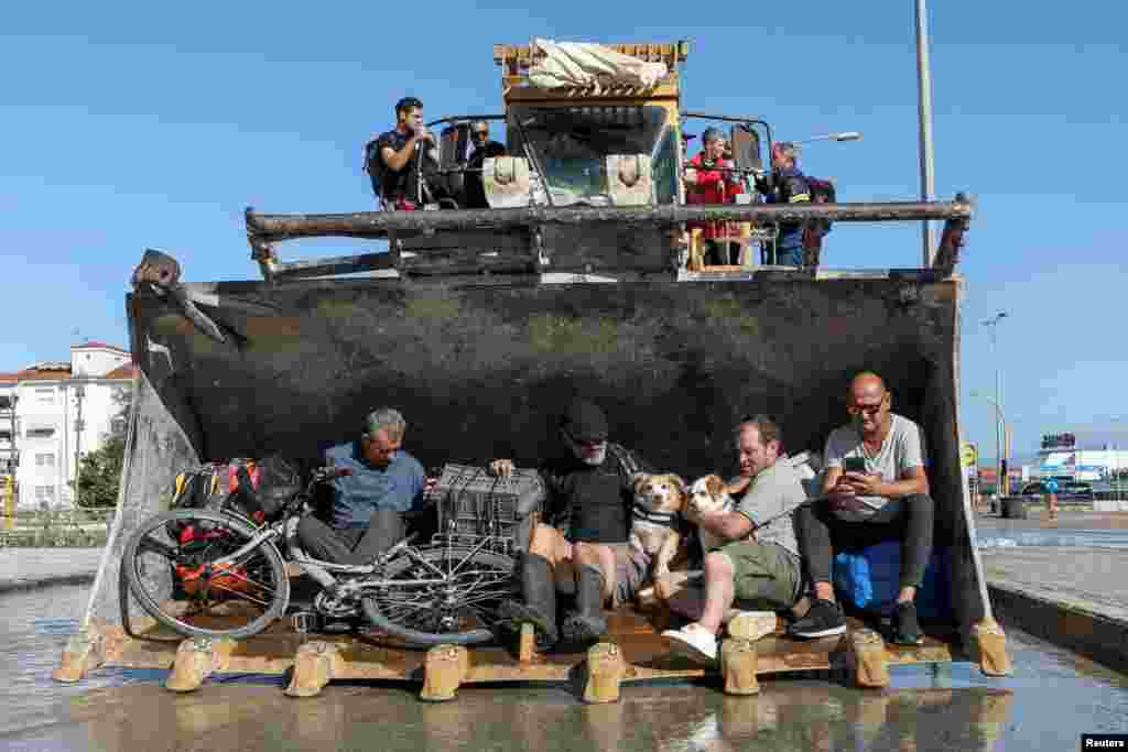 Locals are evacuated from a flooded area, in the aftermath of Storm Daniel, in Larissa, Greece.