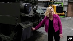 Secretary of the Army Christine Wormuth looks over the latest version of the M1A2 Abrams main battle tank as she tours the Joint Systems Manufacturing Center, Feb. 16, 2023, in Lima, Ohio.