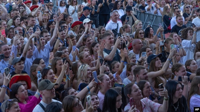 People enjoy a concert at the Atlas Festival in Kyiv, Ukraine, July 21, 2024.