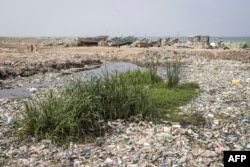 FILE - Plastic waste litters the coastline in Bargny, Senegal, Sept. 17, 2022.