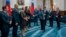 In this photo released by the Taiwan Presidential Office, visiting Australian lawmakers are greeted by Taiwan's President Tsai Ing-wen at the Presidential Office in Taipei, Taiwan, Sept. 26, 2023. 