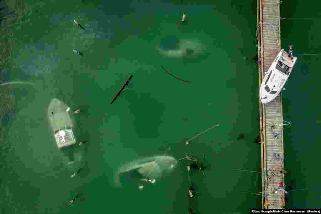 Drone view of sunk boats in the harbor after Storm Babet Rodvig, Denmark, Oct 22, 2023.