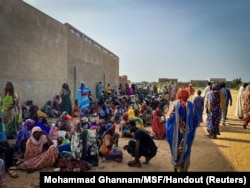 FILE - In this handout photo, Sudanese refugees gather as Doctors Without Borders teams assist the war-wounded from West Darfur, Sudan, in Adre hospital, Chad, June 16, 2023. (Mohammad Ghannam/MSF/Handout via Reuters)