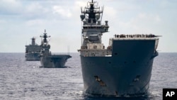 FILE - Royal Australian Navy ships sail in formation with 37 others during the Rim of the Pacific exercises in 2022. The 2024 version is underway now, with 29 nations participating. (Australian Defense Force)