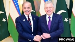 FILE - Pakistani Prime Minister Shehbaz Sharif, left, meets with Uzbek President Shavkat Mirziyoyev on the sidelines of the Shanghai Cooperation Organization summit in Astana, Kazakhstan, July 3, 2024.