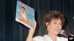 FILE - Raquel Welch promotes her book of physical fitness entitled 'Raquel' at New York's Waldorf-Astoria, Sept. 14, 1984.