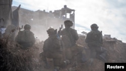 Israeli soldiers operate in the Gaza Strip amid the ongoing conflict between Israel and the Palestinian Islamist group Hamas, in this handout photo released on Dec. 17, 2023. (Israel Defense Forces/Handout via Reuters)