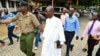 Detectives escort Ezekiel Ombok Odero, head of New Life Prayer Centre and Church in Kilifi County, at the police headquarters for investigations into deaths linked to another Christian cult, in Mombassa, Kenya, April 27, 2023.