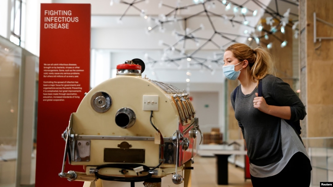 FILE - A staff member poses next to an iron lung in the Science Museum during a Guest Preview Day ahead of the official opening in London, Aug. 17, 2020. Paul Alexander of Dallas, Texas, a polio survivor knows as the "man in the iron lung" died aged 78 on March 12, 2024.