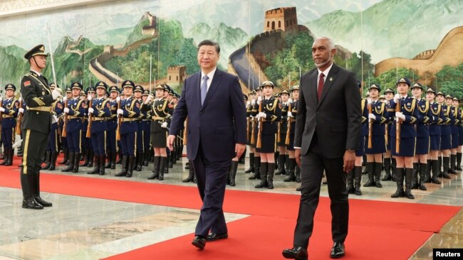 FILE PHOTO: Chinese President Xi Jinping and Maldivian President Mohamed Muizzu attend a welcome ceremony at the Great Hall of the People in Beijing, Jan. 10, 2024. (cnsphoto via Reuters)