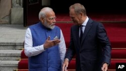 Indian Prime Minister Narendra Modi, left, is greeted by his Polish counterpart Donald Tusk, right, before talks in Warsaw, Poland, Aug. 22, 2024.