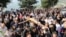 Christian worshipers take part in the Good Friday procession as they carry a cross with a Jesus Christ statue, in the town of Klayaa, southern Lebanon, March 29, 2024. 