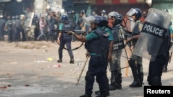 Police try to disperse protesters during a clash with the supporters of the Bangladesh Nationalist Party in Dhaka, Bangladesh, Oct. 28, 2023.