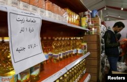 Oil bottles are displayed at a market selling food at discounted prices, after a devaluation of the Egyptian pound led to a sharp increase in prices, in Giza, Jan. 28, 2023.