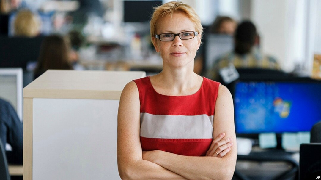 FILE - Maryna Zolatava, chief editor of the Belarus' news outlet Tut.by, which was closed by authorities, poses for a photo in Minsk, Belarus, Aug. 28, 2015.