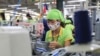 FILE - A worker sews a garment at a factory in Nam Dinh province, Vietnam, Oct. 24, 2017. 