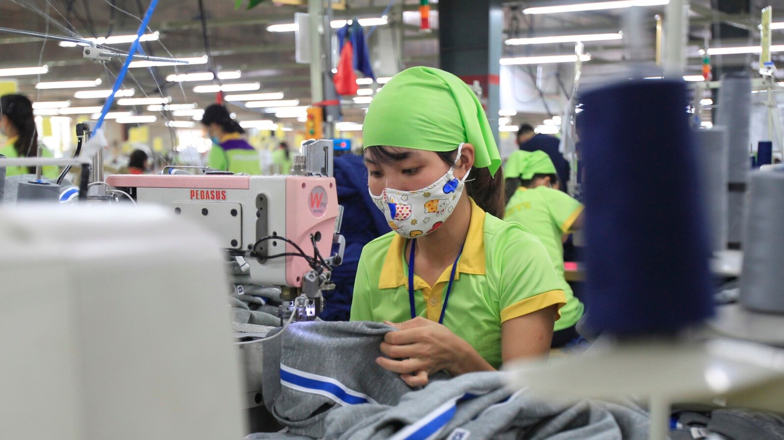 FILE - A worker sews a garment at a factory in Nam Dinh province, Vietnam, Oct. 24, 2017. 