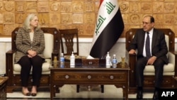 A handout picture released by Iraq's Prime Minister's Media Office on Jan. 21, 2024, shows, former Iraqi prime minister Nuri al-Maliki, right, meeting with U.S. Ambassador Alina Romanowski in Baghdad.