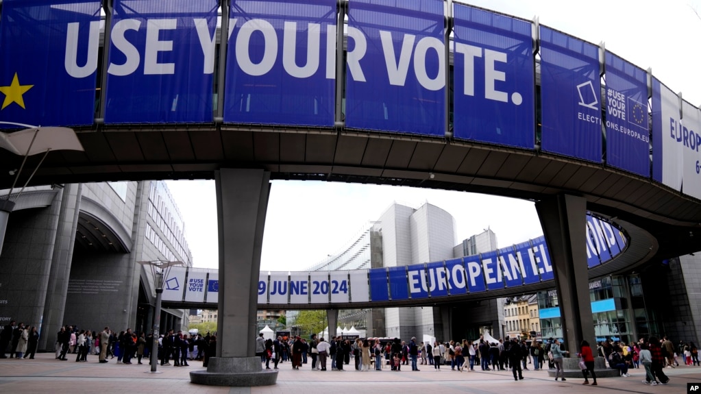 FILE - People wait in line to visit the European Parliament during Europe Day celebrations in Brussels, Belgium, May 4, 2024. 