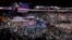 FILE - Participants stand for the signing of the national anthem before the start of the second day session of the Democratic National Convention in Philadelphia, July 26, 2016.