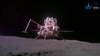 This handout photo taken on June 3, 2024 and released on June 4, 2024 by the China National Space Administration (CNSA) shows the ascender and lander captured by China's Chang'e-6 lunar probe after it landed on the moon. 