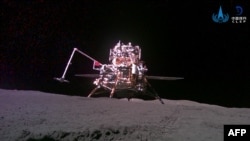 This handout photo taken on June 3, 2024 and released on June 4, 2024 by the China National Space Administration (CNSA) shows the ascender and lander captured by China's Chang'e-6 lunar probe after it landed on the moon. 