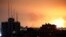 Explosions caused by Israeli airstrikes are visible in the northern Gaza Strip, Oct. 27, 2023.