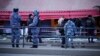 Police officers stand at the site of an explosion at a cafe in St. Petersburg, Russia, April 2, 2023.