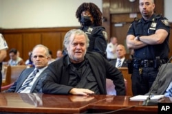 FILE — Steve Bannon, center, appears in Manhattan Supreme Court, in New York, May 25, 2023.