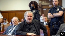 FILE — Steve Bannon, center, appears in Manhattan Supreme Court, in New York, May 25, 2023. 