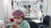 FILE - A worker prepares a dose of vaccine against COVID-19 at the National Taiwan Science Education Center in Taipei City, Taiwan, July 3, 2021. Taiwan, which seeks to expand its source of labor, is taking steps to recruit workers from India, which has high unemployment.