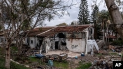 FILE - A battle-scarred home in Kibbutz Be'eri, an Israeli communal farm on the Gaza border, is seen on Jan. 11, 2024. Hamas held more than a dozen hostages in the home when it overran southern Israel on Oct. 7.