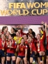 FILE - Spain's players celebrate with the trophy after defeating England to win the 2023 Women's World Cup final in Sydney, Aug. 20, 2023.