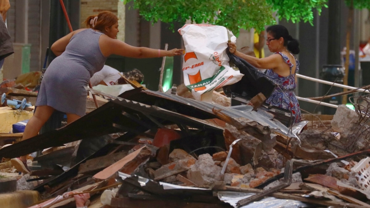 Ecuadorian and Peruvian authorities assess damage following the earthquake that killed at least 15 people