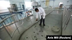 FILE: A Libyan uses a Geiger counter to measure radiation at the Tajoura nuclear research center in Tripoli September 5, 2011. Libya's uranium enrichment program ended but the Tajoura research center continued to stock radioisotopes, radioactive waste and uranium fuel.