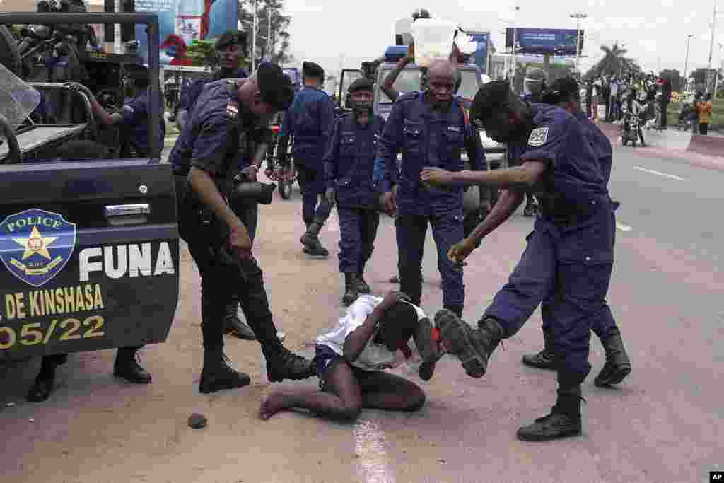 Security forces attack a supporter of presidential candidate Martin Fayulu during clashes outside his party&#39;s headquarters, in Kinshasa, Democratic Republic of the Congo.&nbsp;Fayulu is one of five opposition candidates who say last week&#39;s election should be rerun and question its credibility.&nbsp;