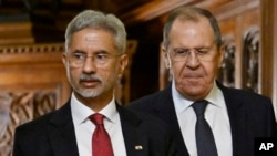 Russia's Foreign Minister Sergey Lavrov, right, and India's Foreign Minister Subrahmanyam Jaishankar arrive for a joint press conference following their talks in Moscow, Dec. 27, 2023. 