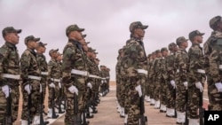 FILE - Members of the Moroccan Royal Armed Forces stand guard as they take part in the 20th edition of the African Lion military exercise, in Tantan, south of Agadir, Morocco, May 31, 2024.