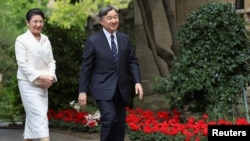 Japan's Emperor Naruhito and Empress Masako walk during a visit to Balliol College at Oxford University as they continue their state visit to the U.K., in Oxford, Britain, June 28, 2024.