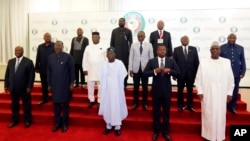 FILE — West African leaders pose for a photo before a regional ECOWAS meeting held in Abuja, Nigeria, Aug. 10, 2023.