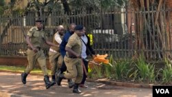 Police arrest a protester during the march to Parliament protest in Kampala, Uganda, July 23, 2024. (Halima Athumani/VOA)