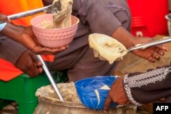 FILE—Volunteers prepare food for internally displaced Muslim devotees for their breaking fast meal during the Islamic holy month of Ramadan in Gedaref on March 13, 2024.