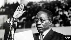 FILE — Senegal's first President Leopold Sedar Senghor takes the oath of office during his inauguration ceremony held in Dakar, Dec 09, 1963