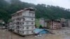 Bangunan terendam banjir bandang yang dipicu oleh hujan deras yang tiba-tiba membanjiri Kota Rangpo di Sikkim, India, Kamis, 5 Oktober. 2023. . (Foto: AP/Prakash Adhikari)