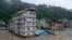 Bangunan terendam banjir bandang yang dipicu oleh hujan deras yang tiba-tiba membanjiri Kota Rangpo di Sikkim, India, Kamis, 5 Oktober. 2023. . (Foto: AP/Prakash Adhikari)