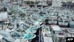 Fishing boats are moored at Tunggang fishing harbor ahead of the arrival of Typhoon Koinu in Pingtung county on Oct. 4, 2023.