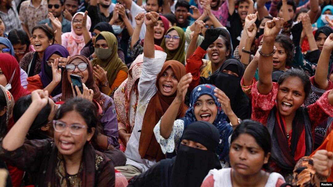 FILE - Students and job seekers shouts slogans as they protest, calling for a ban on quotas for government jobs, at Shahbagh Square in Dhaka, Bangladesh, July 3, 2024.